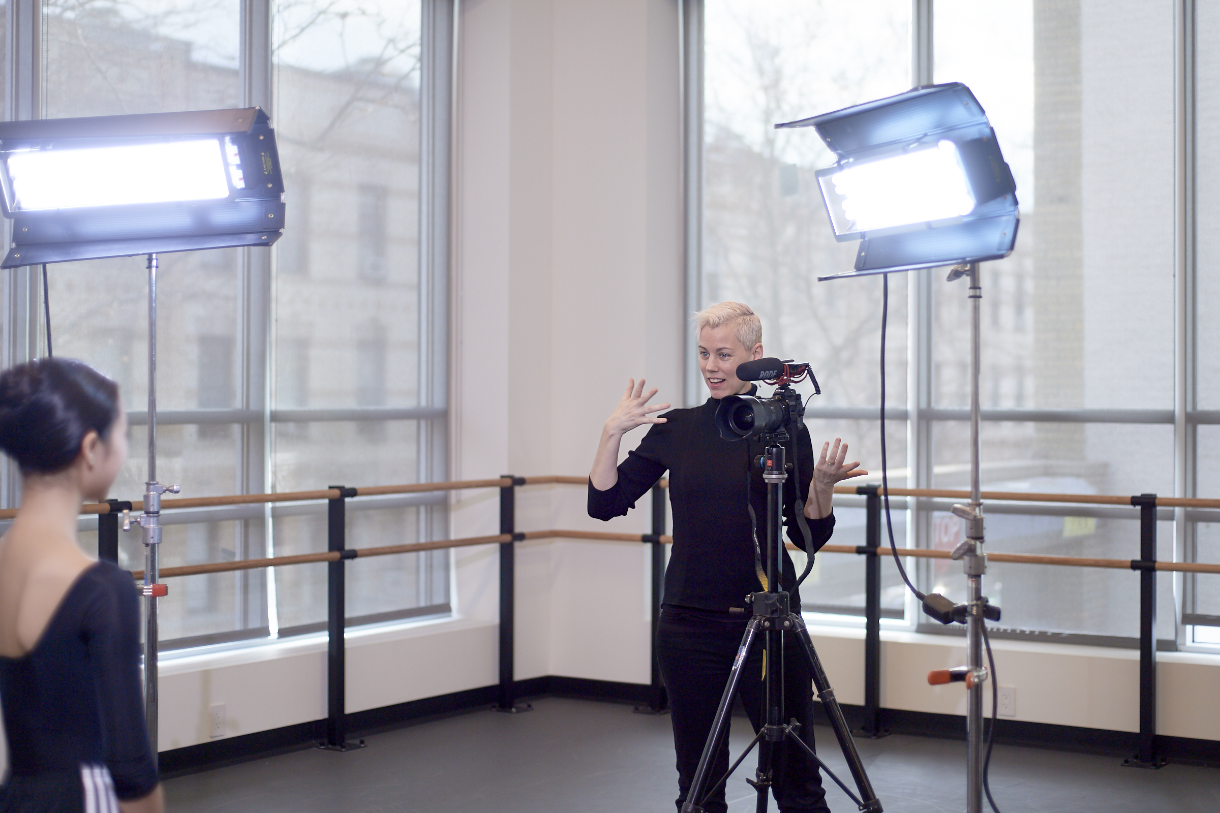 Rachel Neville coaching a dancer for an audition video shot in a ballet studio